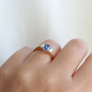 Emerald Cut Blue Sapphire Ring being worn side profile view