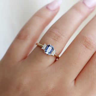  Emerald Cut Blue Sapphire Ring being worn side view