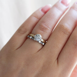 Round salt and pepper diamond with with deco diamond band