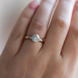 Round salt and pepper diamond ring close up on hand