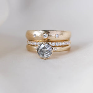 Round salt and pepper diamond ring with diamond bands