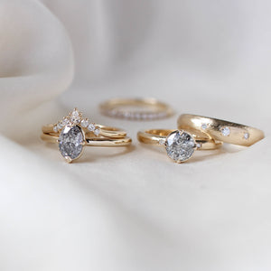 Round salt and pepper diamond ring with wedding bands group shot