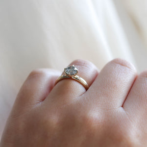 Round salt and pepper diamond ring profile view on hand