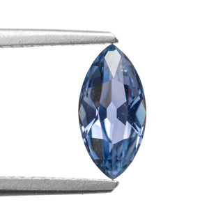 Blue antique cut marquise sapphire in tweezers