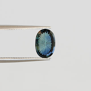 Teal oval fantasy cut sapphire