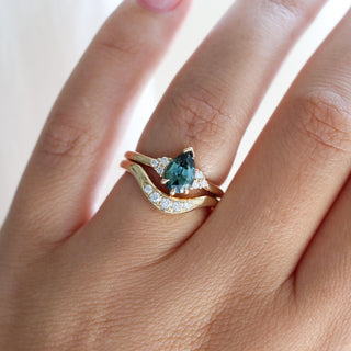 Pear Teal Green Sapphire Ring stacked with wave diamond gold band worn on hand