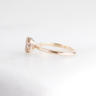 Yellow gold solitaire engagement ring with an oval champagne diamond, half view