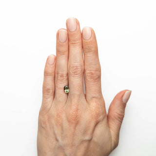 Green oval brilliant cut sapphire on hand