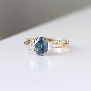 Oval Cut Blue Sapphire Ring with diamond gold band quarter side view