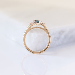 Oval Cut Blue Sapphire Ring profile view with marble