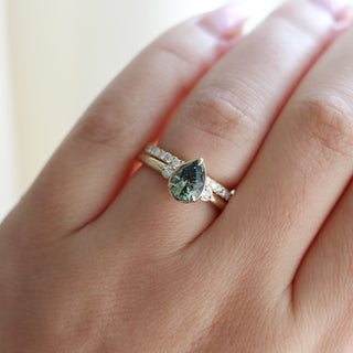 Lagoon Pear Green Sapphire Ring paired with diamond gold band worn on hand front view