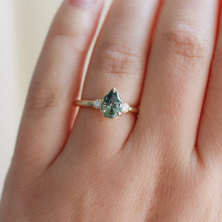 Lagoon Pear Green Sapphire Ring on hand detailed front view