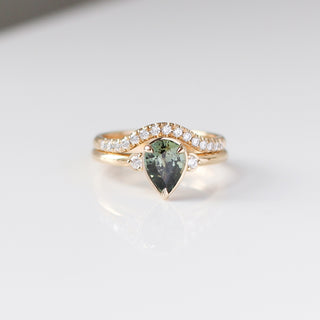 Lagoon Pear Green Sapphire Ring stacked with wave diamond gold band detailed front view 