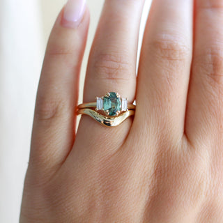 Trilogy Oval Green Sapphire Ring stacked with wave gold band on hand 