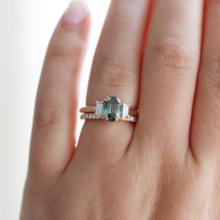 Trilogy Oval Green Sapphire Ring stacked with diamond gold band worn on hand front view