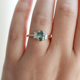 Trilogy Oval Green Sapphire Ring worn on hand