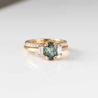 Trilogy Oval Green Sapphire Ring stacked with diamond gold band quarter front view