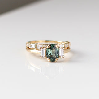 Trilogy Oval Green Sapphire Ring stacked with diamond gold band detailed quarter front view  