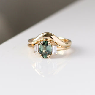 Trilogy Oval Green Sapphire Ring stacked with wave gold band detailed front view