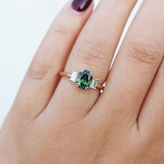 Oval Cut Green Sapphire Ring being worn on hand 