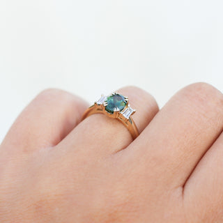 Oval Cut Green Sapphire Ring worn on hand side profile view