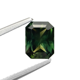1.72ct Radiant Cut Green Sapphire in tongs