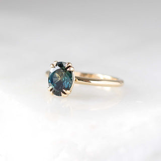 Teal oval sapphire solitaire ring three quarter view