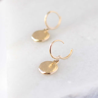 Golden drop earrings side view close up 