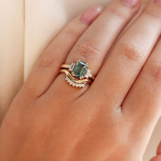 Emerald Cut Teal Sapphire Ring with diamond gold band worn on hand