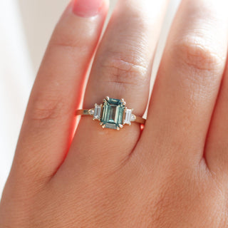 Emerald Cut Teal Sapphire Ring on hand 