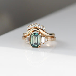 Emerald Cut Teal Sapphire Ring stacked with gold diamond band 