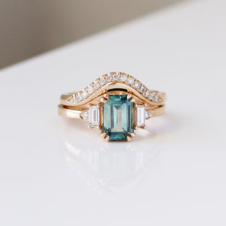 Emerald Cut Teal Sapphire Ring paired with gold wave diamond band