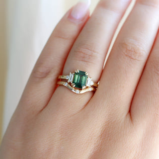Misceo Emerald Cut Green Sapphire Ring stacked with 3 point diamond gold ring worn on hand front view 