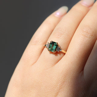 Misceo Emerald Cut Green Sapphire Ring in sunlight worn on hand