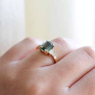 Misceo Emerald Cut Green Sapphire Ring on hand detailed quarter side view