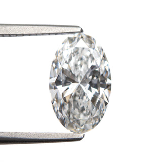 White oval brilliant cut lab created diamond in tongs
