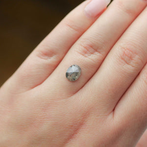 Oval shaped salt and pepper diamond on hand