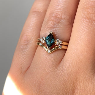 Teal Kite Sapphire Ring with diamond gold band on hand in sunlight