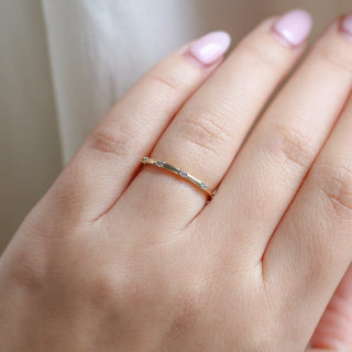 five diamond wedding band worn on hand