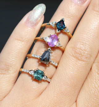 Gemstone rings on hand in sunlight