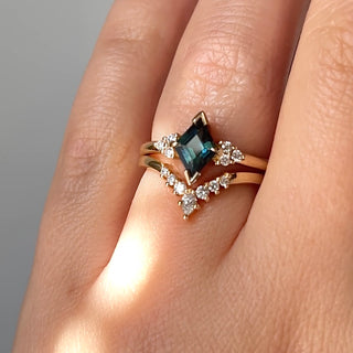 Teal Kite Sapphire Ring with crown diamond gold band on hand in sunlight