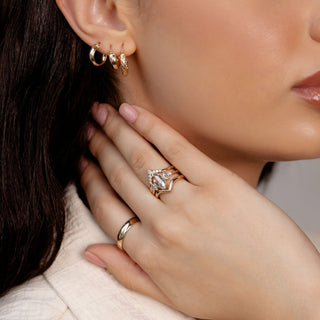 Marquise salt and pepper diamond ring with wedding bands on hand