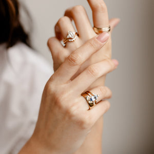 Hexagon diamond engagement ring with diamond wedding band on hand
