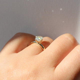 Oval diamond ring side view on hand