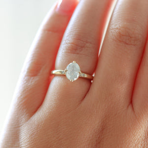 Oval diamond engagement ring on hand