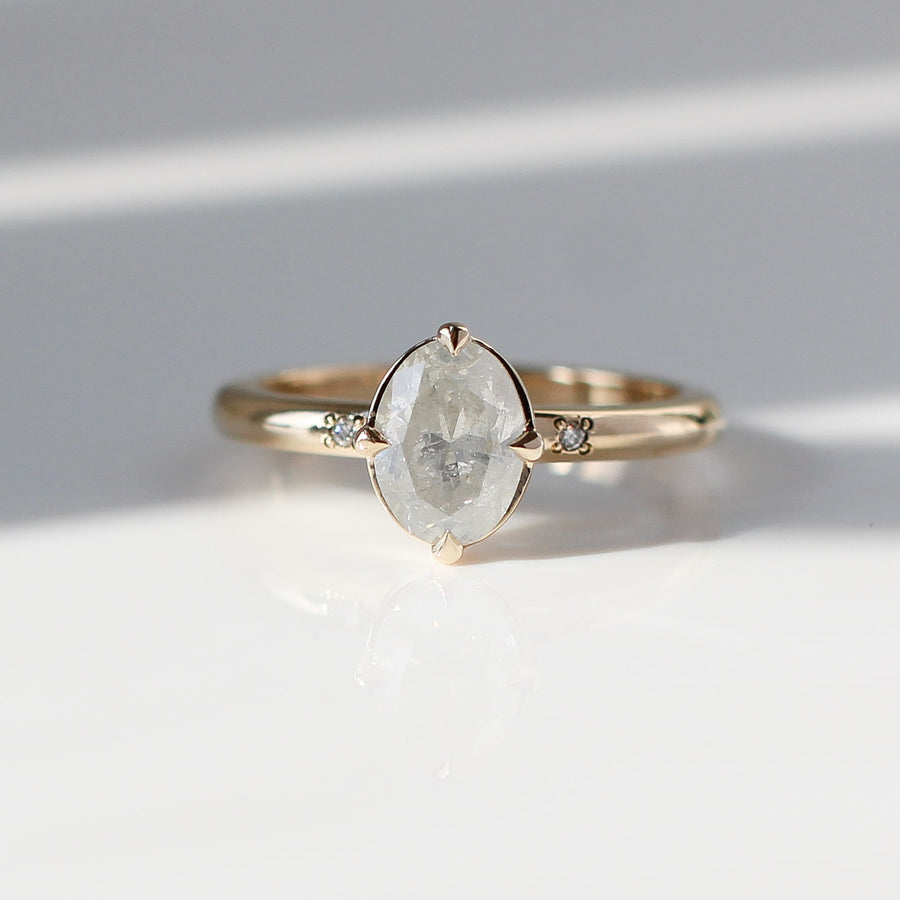 Oval diamond engagement ring in sunlight