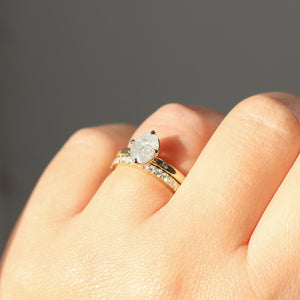 Oval diamond ring with diamond band on hand