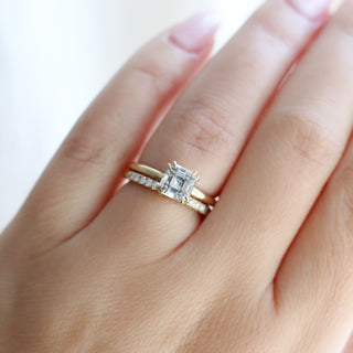 Asscher Cut Sapphire Ring paired with diamond gold band being worn