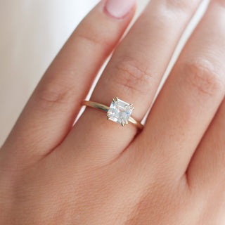 Asscher Cut Sapphire Ring being worn on hand front etail view