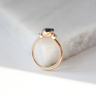 Pear blue sapphire engagement ring profile view